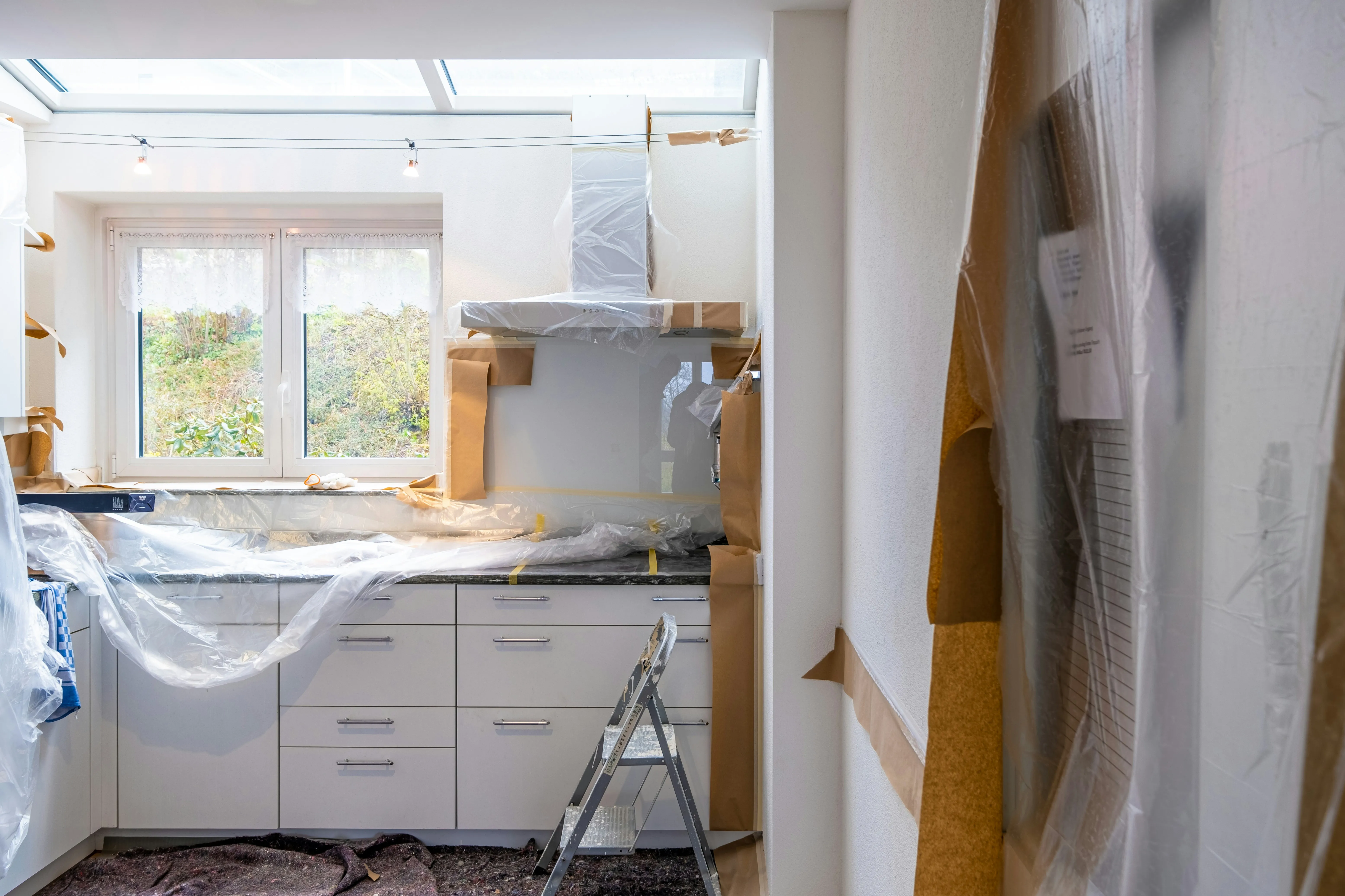 Modern kitchen and open-concept renovation in Toronto with custom cabinetry and lighting